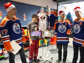Jordan Eberle and Taylor Hall visited Stollery Children’s Hospital in December. But recent news on the Oilers’ front must feel like early Christmas presents for next season.Ian Kucerak/Edmonton Sun/Postmedia Network