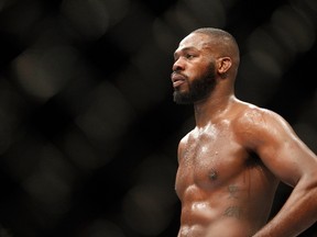 Light heavyweight champion Jon Jones waits during a timeout as he defends his title against Daniel Cormier at UFC 182 on January 3, 2015 in Las Vegas. (Steve Marcus/Getty Images/AFP)