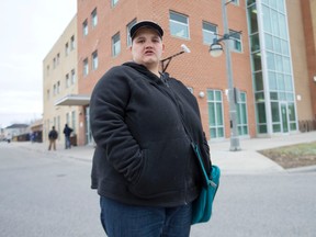 Jenny Finch, who was living at 1451 Oxford St. E. before a fire that caused fatal injuries to one resident last November led to the group home being shut down, stands outside of the Salvation Army Centre of Hope, where she has been living on and off since.  (CRAIG GLOVER, The London Free Press)