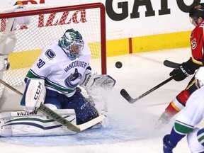 Calgary Flames Sam Bennett can't beat Vancouver Canucks goalie Ryan Miller during first-period NHL playoff action in Calgary on Saturday. (Darren Makowichuk/Postmedia Network)