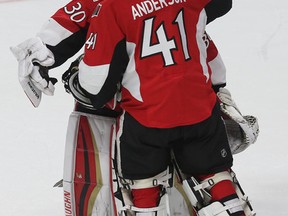 The Ottawa Senators Craig Anderson and Andrew Hammond hug after losing to the Montreal Canadiens at the Canadian Tire Centre in Ottawa Sunday April 26, 2015. The Montreal Canadiens eliminated the Senators out of the playoffs by defeating them 2-0 Sunday. Tony Caldwell/Postmedia Network