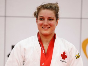 Kelita Zupancic receives her gold during a medal ceremony for the -70 kg class Friday, April 24 at the 2015 Pan Am Judo Championships at the Saville Community Sports Centre in Edmonton. Ian Kucerak/Edmonton Sun