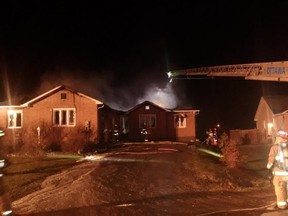 Fire crews battle a house fire on Danbury Cres. in North Gower early Monday morning. (TODD HORRICKS Ottawa Fire Dep`t via Twitter)