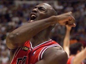 Chicago Bulls' Michael Jordan celebrates after the Bulls defeated the Utah Jazz in Game 6 of the NBA finals to win their sixth championship in Salt Lake City, in this June 14, 1998 file photo. (REUTERS)