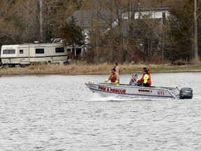 Members of Mohawk Fire Department search for two missing boaters/fishermen Tyler Maracle and Matt Fairman on the Bay of Quinte between Deseronto, Ont. and Tyendinana Mohawk Territory, Ont, the day after the pair went missing, Monday, April 27, 2015. -  Jerome Lessard/Belleville Intelligencer/Postmedia Network
