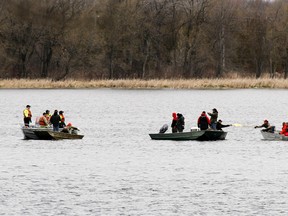 JEROME LESSARD/THE INTELLIGENCER
Members of Mohawk Fire Department, left, and local fishermen search for two missing boaters/fishermen Tyler Maracle and Matt Fairman on the Bay of Quinte between Deseronto and Tyendinana Mohawk Territory. The pair have been missing for nearly two weeks and a $100,000 reward has now been created for their return.