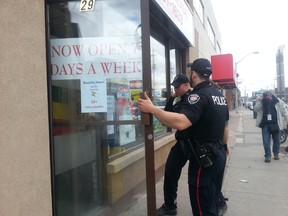 The BuzzOn Cannabis Lounge gets a visit from Ottawa Police on Monday, just hours after announcing it has opened. (JON WILLING Ottawa Sun)
