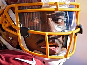 Quarterback Robert Griffin III #10 of the Washington Redskins looks on against the St. Louis Rams at FedExField on December 7, 2014 in Landover, Maryland. The St. Louis Rams won, 24-0.  (Patrick Smith/Getty Images/AFP
== FOR NEWSPAPERS, INTERNET, TELCOS & TELEVISION USE ONLY ==
