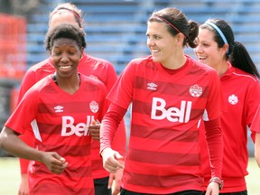 Canadian soccer player Christine Sinclair (r) shares a laugh with a group of teammates during practice in Winnipeg, Man. Monday May 05, 2014.
(Brian Donogh/Winnipeg Sun/QMI Agency)