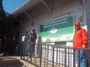 John Arends and Anthony Clark pose outside Wallaceburg railway station on Arnold Street on April 25. The Southern Ontario Locomotive Rail Society—St. Clair chapter is working to try and restore the station.