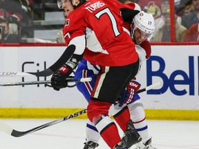 Ottawa Senators' Kyle Turris battles with Montreal Canadiens' Torrey Mitchell during NHL action in Ottawa on Sunday, April 26, 2015. (Errol McGihon/Ottawa Sun/Postmedia Network)