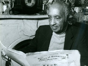 Fred Jenkins, owner and publisher of Canada?s only newspaper for blacks, Dawn of Tomorrow, looks over some back issues in a file photo from 1990. The paper was started by his parents in 1921. (Free Press file photo)