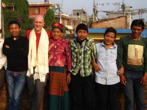 Queen’s University geology professor Laurent Godin, third from left, stands on the roof of the Tamang family’s house in Kathmandu, Nepal, with friends, from left, Dawa Tamang, Sarthra Tamang, Lakpi Dorma Tamang, Phurba Tamang, Indira Tamang and Pradap Tamang. The house was destroyed in Saturday’s earthquake. (Supplied photo)