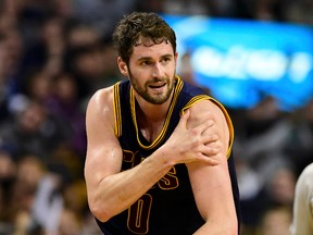 Cleveland Cavaliers forward Kevin Love holds his injurded shoulder during Game 4 of the first round of the NBA playoffs against the Boston Celtics at TD Garden. (Bob DeChiara/USA TODAY Sports)
