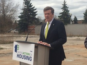 Mayor John Tory in a vacant lot at 200 Madison Ave. on Monday, April 27, 2015, to announce the city will be cutting red tape to help developers build more social housing. (Don Peat/Toronto Sun)