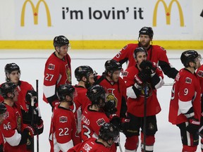 The Ottawa Senators gather on the ice after losing to the Montreal Canadiens in Game 6 at the Canadian Tire Centre Sunday, April 26, 2015. (Tony Caldwell/Ottawa Sun)