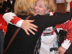 Skip Lois Fowler (r) is hugged by a supporter upon her arrival in Winnipeg, Man. Monday April 27, 2015 after winning the World Senior Women's Curling Championship.
Brian Donogh/Winnipeg Sun/Postmedia Network