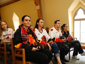 Madison Orrick (first from left) Sofija Reston, Richele Wood, Jason Easton and Kassie Seymour, were among a group dubbed Bring OHL Hockey Back, who attended Monday's council meeting to show support for city efforts to fill the vacant Yardmen Arena with a new hockey tenant.