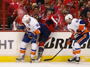 Washington Capitals winger Tom Wilson (43) and New York Islanders centre John Tavares (91) battle for the puck in Game 7 of the first round of the 2015 playoffs Monday at Verizon Center. (Geoff Burke/USA TODAY Sports)