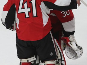 Ottawa Senators goalies Craig Anderson and Andrew Hammond hug after losing to the Montreal Canadiens at the Canadian Tire Centre in Ottawa Sunday, April 26, 2015. (Tony Caldwell/Ottawa Sun)