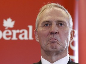 Former Toronto police chief and potential Liberal candidate Bill Blair takes part in a news conference in Ottawa with Justin Trudeau April 27, 2015. (REUTERS/Chris Wattie)