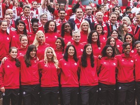 Members of Canada’s 23-player squad for the coming Women’s World Cup pose for a photo at the unveiling event on Monday. (CARMINE MARINELLI/Postmedia Network)