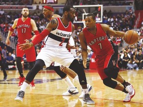 Raptors guard Kyle Lowry dribbles the ball as Wizards’ John Wall defends during Game 4 of their first-round series. (USA TODAY SPORTS)
