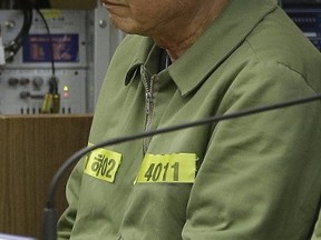 Lee Joon-seok, the captain of the sunken South Korean ferry Sewol, sits for verdicts as the ship's crew members are charged with negligence and abandonment of passengers in the disaster at Gwangju High Court in Gwangju, South Korea, Tuesday, April 28, 2015. A South Korean appellate court on Tuesday handed down a sentence of life in prison to the captain of a ferry that sank last year, killing more than 300 people. REUTERS/Ahn Young-joon/Pool