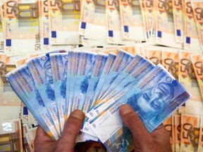 A picture illustration of Swiss Franc and Euro banknotes taken in central Bosnian town of Zenica, January 26, 2015. (REUTERS/Dado Ruvic)