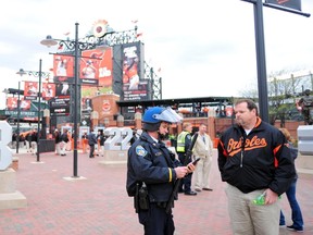 Baltimore police officers stand outside the stadium prior to the cancellation of the game between the Chicago White Sox and Baltimore Orioles at Oriole Park at Camden Yards on April 27, 2015. (Evan Habeeb/USA TODAY Sports)
