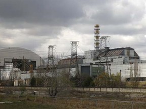 A general view shows the New Safe Confinement (NSC) structure (L) at the site of the Chernobyl nuclear power plant April 21, 2015. REUTERS/Valentyn Ogirenko