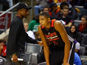 Coach Dwayne Casey talks with rookie Bruno Caboclo during practice this season. Having their own D-League team would allow the Raptors to better develop players such as Caboclo. (Dave Abel/Toronto Sun)