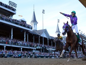 Victor Espinoza, aboard California Chrome, celebrates after winning last year’s Kentucky Derby at Churchill Downs. (USA Today Sports)