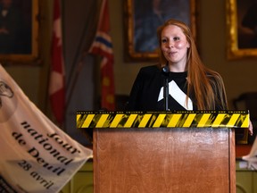 Briana Broderick speaks at City Hall on Tuesday morning during an event marking National Day of Mourning. (James Paddle-Grant/For The Whig-Standard