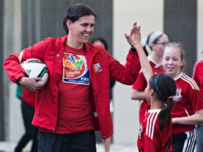 Team Canada veteran Christine Sinclair interacts with young soccer players while in Edmonton Tuesday for the unveiling of a special stamp commemorating the 2015 Women's World Cup. (Codie McLachlan, Edmonton Sun)