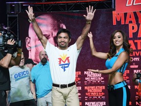 WBO welterweight champion Manny Pacquiao arrives at the Mandalay Bay Convention Center in Las Vegas on Tuesday.  (Getty Images/AFP)