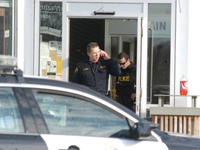 Police converge on Walpole Island's Thunderbird Plaza on April 26 after a man allegedly assaulted another man.