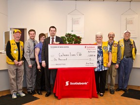 Matthew deRidder, Kathy Barrette, Findley Barr, Paul Allard, Rick Warrell, Devon Prevost, and Teresa Tremblay pose with the $1,000 presentation cheque on Wednesday Apr. 22nd at the Scotia Bank.