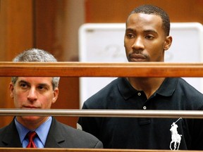Former Los Angeles Lakers guard Javaris Crittenton (R) appears in Los Angeles Superior Court for an extradition hearing with attorney Brian Steel (L) in downtown Los Angeles August 31, 2011. (REUTERS)