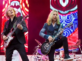 James Young (L) and Tommy Shaw of Styx performing at Ottawa's Bluesfest on Tuesday July 8, 2014.