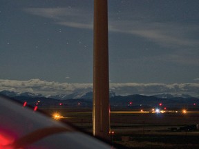 Aviation warning lights flash on top of wind turbines just north of Pincher Creek, Alta. The MD approved sending a letter to the federal transport minister, Lisa Raitt, requesting a review of wind turbine warning light regulations. John Stoesser photos/Pincher Creek Echo.