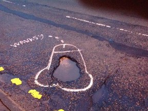A "road artist" known as Wansky has been bringing attention to potholes in his city by drawing penises around them. (Facebook)