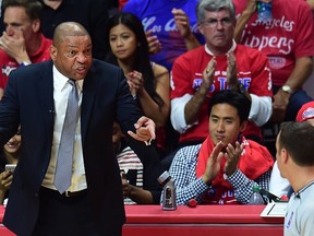 Coach Doc Rivers of the Los Angeles Clippers expresses his frustration at an official as the Clippers played the San Antonio Spurs in Game 5 of their first round NBA playoffs series in Los Angeles, California on April 28, where the Spurs defeated the Clippers 111-107. (AFP/FREDERIC J. BROWN)