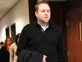 Joshua Nowlan, shot in the Aurora theater shooting, leaves court after a hearing for James Holmes, the accused in the case in Denver January 11, 2013. Accused movie theater gunman James Holmes has been ordered to stand trial on charges he shot 12 people to death and wounded dozens more at a midnight screening of a Batman film last summer, but he is unlikely to enter a plea at a Friday court appearance.  REUTERS/Rick Wilking