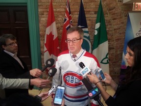 Mayor Jim Watson sports a P.K. Subban jersey while speaking with the media on Wedneday. JON WILLING/OTTAWA SUN