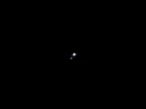 A picture of Pluto and its largest moon, Charon, taken by the Ralph color imager aboard NASA's New Horizons spacecraft, is seen in this NASA image taken April 9, 2015. (Reuters/NASA/Johns Hopkins University Applied Physics Laboratory/Southwest Research Institute/Handout)