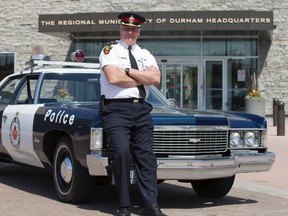 Supt. Greg Mills in front of Durham Regional Police headquarters on April 29, 2015. Mills is retiring after over 40 years as a police officer. (Craig Robertson/Toronto Sun)