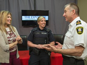 Retired probation officer Holly McDonald (left) and Brantford police Const. Laura Collier talk with Brant County ambulance service deputy chief Randy Papple on Wednesday prior to taking part in a live chat broadcast on The Expositor's website. (Brian Thompson / The Expositor)