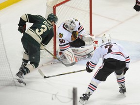 Minnesota Wild winger Charlie Coyle (3) shoots against Chicago Blackhawks goalie Corey Crawford (50) in the 2014 playoffs. (USA Today Sports)