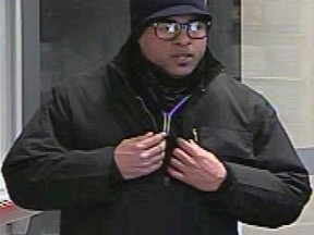 Investigators need help identifying this man, who is suspected of robbing a bank in Toronto's Financial District last month. Cops now wonder if the wanted man is in hiding outside the GTA. (Toronto Police photo)